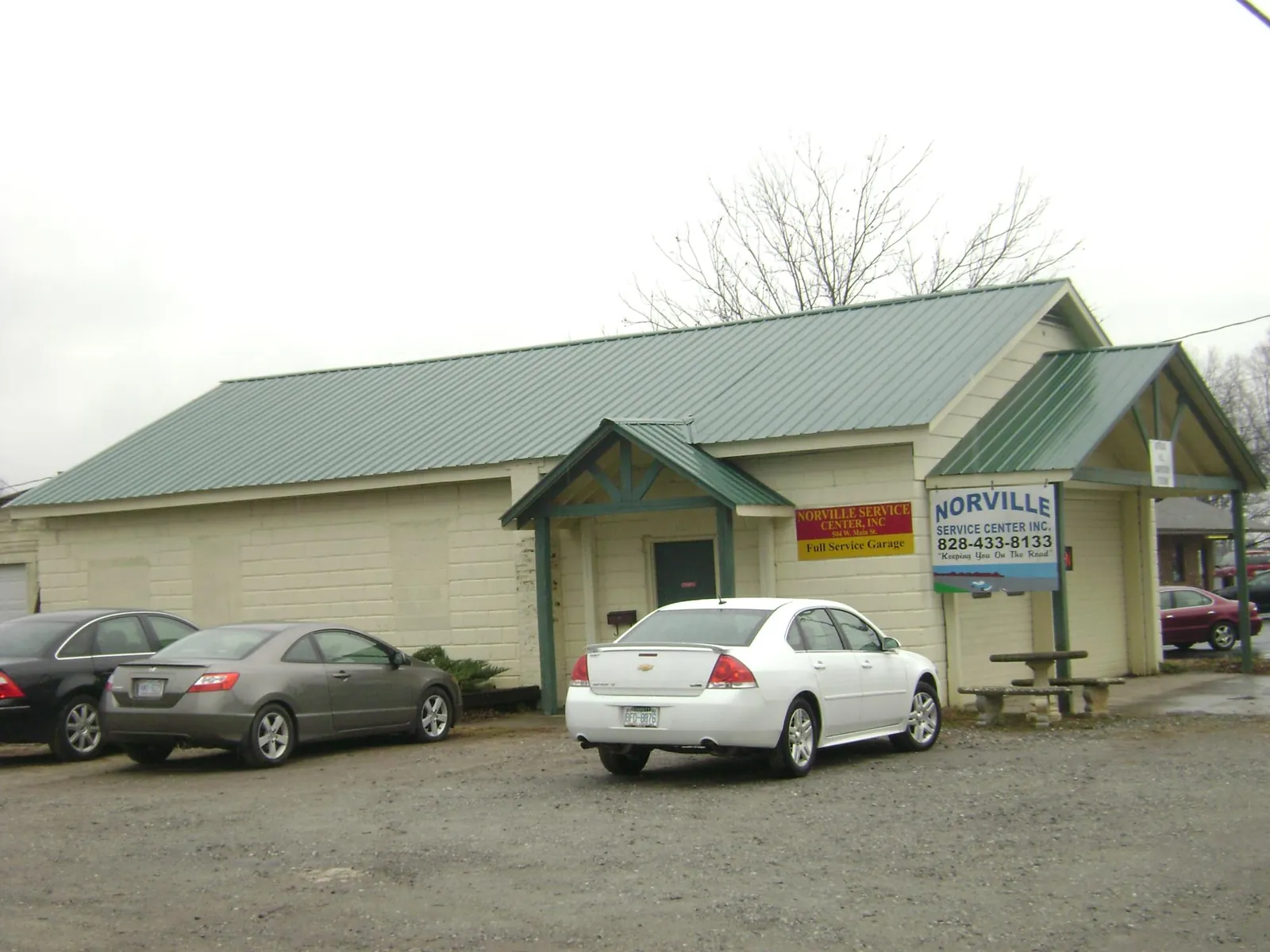 Green metal roof on a service garage with a covered entry in Rimrock